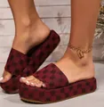 Close-up of maroon platform slippers featuring elegant black floral embroidery patterns. - 36 / Single Strap Slipper (1) / Burgundy