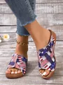 Casual women's fish-mouth slippers with US flag pattern worn on rustic wood background. - 36 / Blue