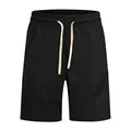 Detailed view of black ribbed casual golf shorts featuring an adjustable cream drawstring - S / Bottoms / Black