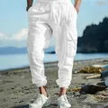 Detail of white cotton linen cargo pants featuring drawstring waist and multiple pockets - S / Bottoms / White