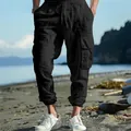 Detailed macro shot of black cotton linen drawstring cargo pants with side pockets - S / Bottoms / Black