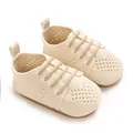Close-up detail of breathable mesh knit baby walking shoes in a soft cream color - 11cm / Apricot