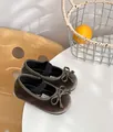 Detail view of velvet baby girl Mary Jane shoes with bow and soft sole in grey - Size 22 (14.5CM) / Green