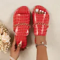 Close-up detail of red crocodile texture flat slides featuring elegant gold chain - 36 / Red