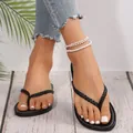 Vista dettagliata di eleganti infradito nere intrecciate per donna con suola in TPR - 36 / Nero
