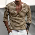 Close-up detail of men's slim fit brown striped pique fabric long-sleeve Henley shirt - S / Tops / Dark Khaki