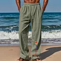Détail du pantalon large en coton et lin pour homme avec imprimé perroquet - Vert