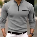 Close-up of men's gray ribbed polo shirt with half-zip and chest zipper detail - S / Tops / Gray