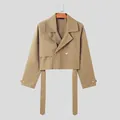 Detail shot of men's khaki cropped trench jacket with wide lapels and waist straps. - M / Tops / Khaki