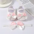 Detail showing the soft-bottom baby princess shoes and matching bow headband set. - Size 11 (Inner Length 10.5cm) / White