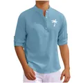 Detail view of blue waffle-knit men's long sleeve shirt with palm tree print - Blue