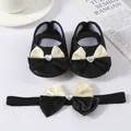 Detail showing soft-sole black baby princess shoes with a matching heart bow headband set - Size 11 (Inner Length 10.5cm) / Black