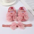 Detailed view of pink baby shoes and headband set with organza bows and pearls. - Beaded Pinkish + Headband