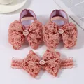 Detail view of pink lace bow baby shoes and matching elastic headband set - Korean Pink
