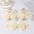 Detail of cream baby shoes and headband set with large lace bows and pearls. - Beige