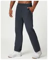 Detail view showing the relaxed fit and soft fabric of these men's navy sweatpants. - S / Bottoms / Dark Navy