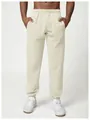 Close-up of men's cream-colored joggers featuring elastic waistband and cuffed ankles. - S / Bottom (DWK1017) / Bright yellow