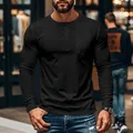 Detailed view of a men's slim fit black long sleeve Henley shirt with a chest pocket - M / Tops / Black