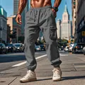 Detailed view of grey men's cotton linen cargo pants featuring drawstring and pockets - S / Bottoms / Gray