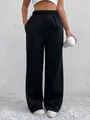 High waisted black fleece lined sweatpants for women showing relaxed fit and pocket detail - S / Black