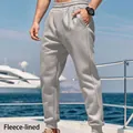 Premium men's solid light grey fleece-lined joggers ideal for winter outdoor sports - Light Gray
