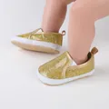 Close-up of sparkling gold glitter baby walker shoes worn by an infant on soft surface - Insole Length 11cm / Gold