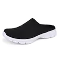 Breathable fly-knit mule sneaker in black with a comfortable white athletic sole. - 35 / Black