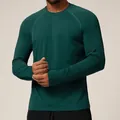 Seamless dark teal long-sleeve athletic performance shirt with moisture-wicking fabric - Dark Green