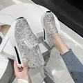 A close-up detail of women's silver lace mesh platform loafers with sparkling rhinestones - 36 / Silver