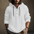 Detailed view of men's white cotton linen hooded shirt with textured fabric and buttons - White
