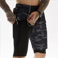 Men's camouflage 2-in-1 sports shorts featuring a hidden phone pocket and headphone hole. - Black Camo