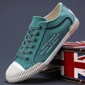 Premium men's teal canvas sneakers with a stylish textured white rubber toe cap. - 38 / Dark Green (24873)