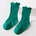 Close-up of green ribbed distressed socks with stylish ripped hole design details - M (1-3 Years) / Cyan