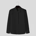 Detailed view of black long-sleeved shirt with mesh sleeve stitching and matching tie - L / Tops / Black