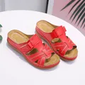 Comfortable red wedge sandals for women featuring breathable cut-outs and adjustable straps. - 35 / Red