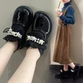 Detailed view of girls' black patent leather shoes with pearls and sock collar. - Size 23 (Inner Length 14.5cm) / Black