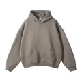 Détail d'un sweat à capuche gris oversize avec capuche sans cordon et poche kangourou - XS / Hauts / Gris Café