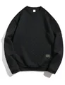 Close-up detail of black heavyweight waffle texture men's crewneck pullover sweatshirt - Black