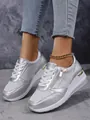 Side detail view of silver metallic platform sneakers with zipper and lace-up design - 37 / Silver