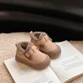 Detailed view of fleece-lined toddler winter shoes with buckle strap on a cozy background - Khaki