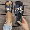 Women's black snakeskin flat slide sandals with gold chain and square toe design - 35 / Black