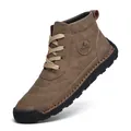 Detailed view of brown hand-stitched men's high-top Martin boots with rubber sole - Khaki