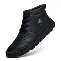 Detail view of black leather high-top boot with textured grain and hand-stitched sole - 39 / Black