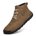 Detail of brown hand-stitched high-top leather Martin boots for men with durable rubber sole - 40 / Tan