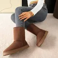 Detailed view of women's brown suede high-top snow boots with thick plush lining for winter - 36 / Coffee