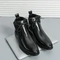 Sleek black men's Chelsea boots in British style with polished finish and lace-up detail - Black