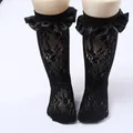 Close-up detail of children's black lace mesh socks with elegant ruffled satin trim - One Size (0-8 Years) / Satin Edge Style / Black