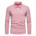 Close-up of a pink long-sleeved polo shirt with buttoned collar and soft fabric texture - M / Tops / Pink