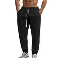 Detailed view of men's black knitted joggers featuring drawstring waist and textured fabric - S / Bottoms / Black
