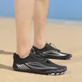Professional black outdoor water shoes with silver accents on a sunny sandy beach - 35 / Black